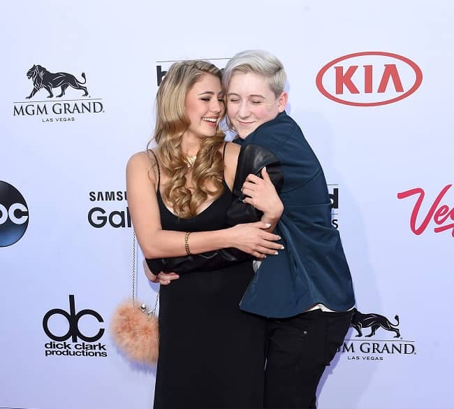 Lia Marie Johnson and singer Trevor Moran posing for a photo at the 2015 Billboard Music Awards at Garden Arena on 17 May 2017