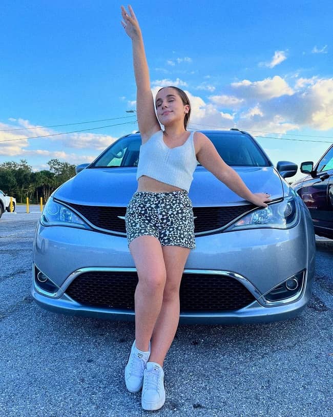 Sienna Belle with car