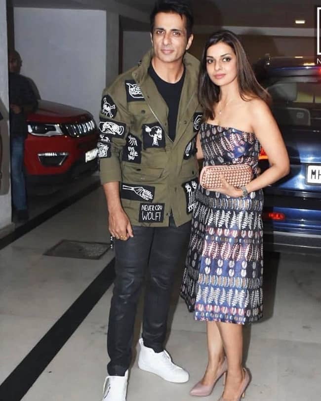 Sonali Sood posing for a photo with her husband Sonu Sood